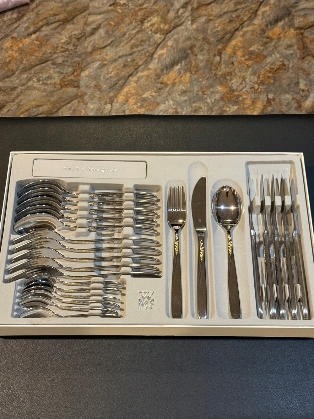 New in box 24-Piece Polished Stainless Flatware Set in Silver